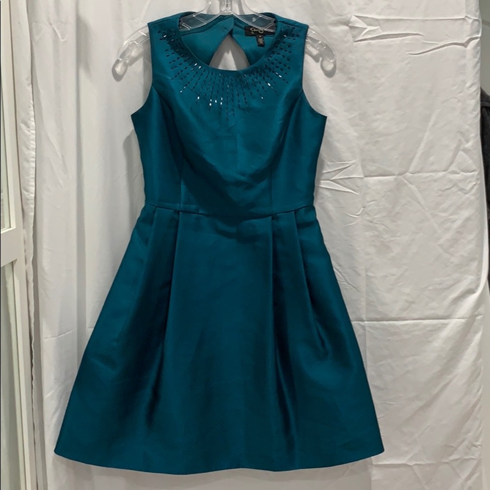 A dark green colored dress. Size 2-4